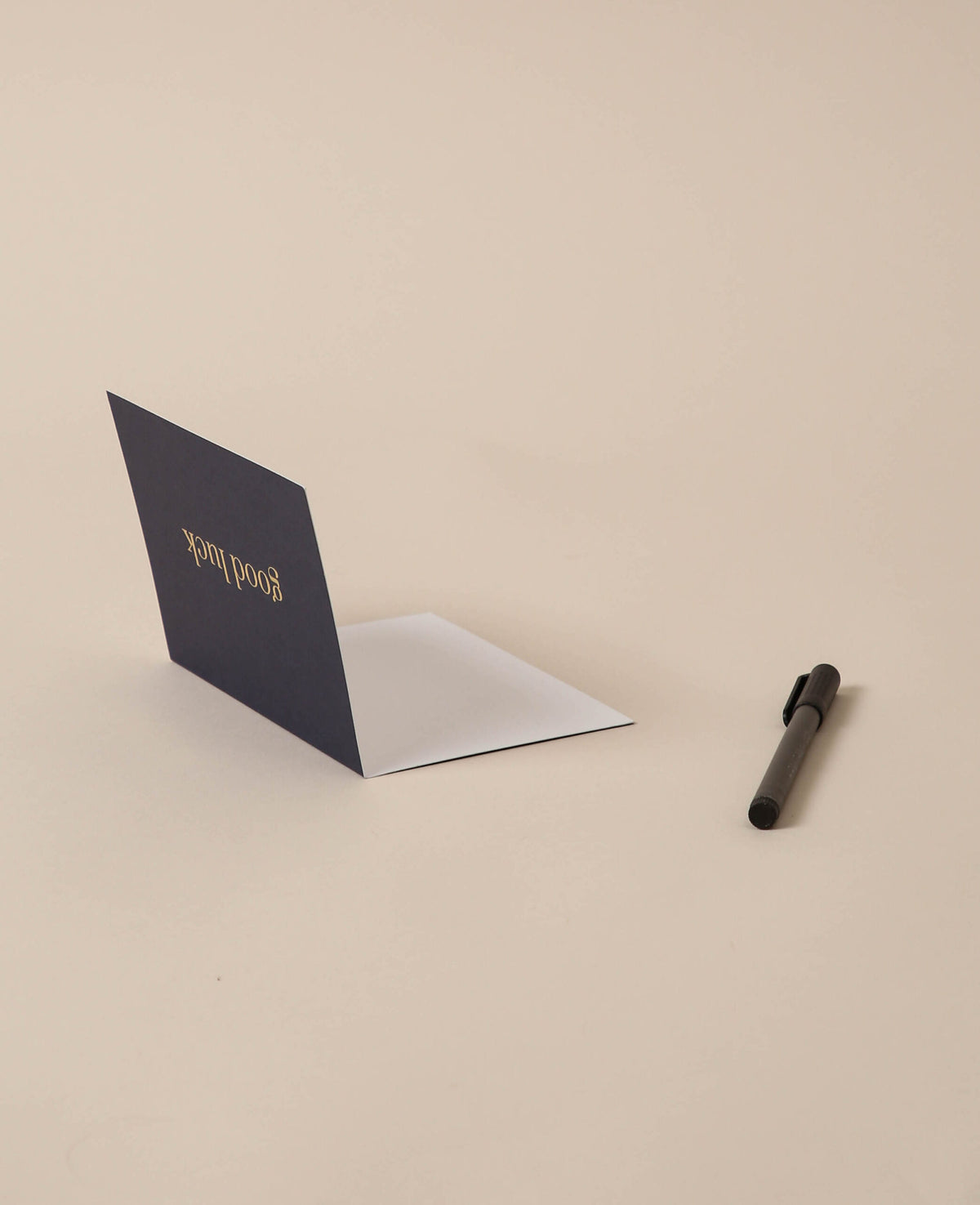 Dark blue folded card, good luck